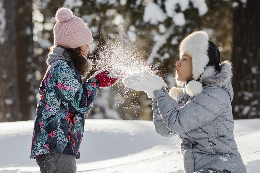 woman and girl playing together medium shot